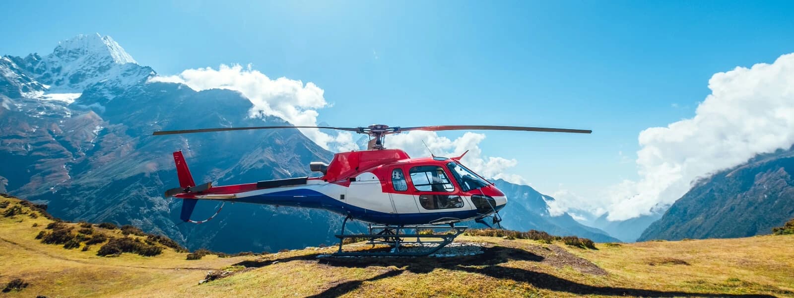 Beautiful scenery of valleys and snow-capped mountains seen from an Everest helicopter tour