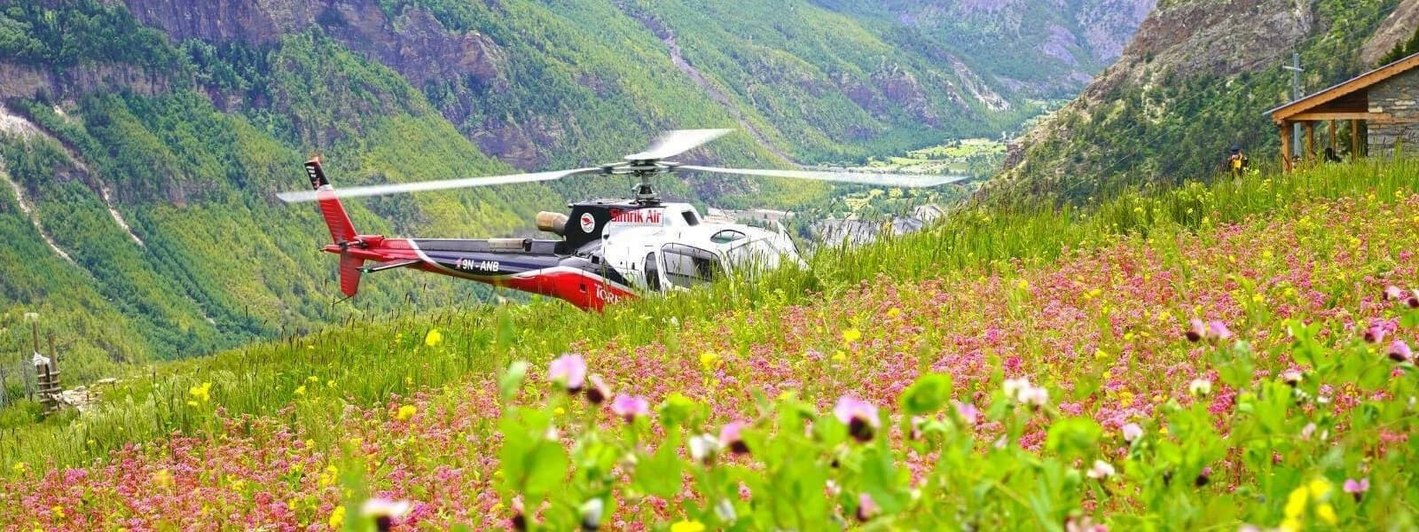 a picturesque helicopter ride above Nepal's Langtang Valley, providing amazing views of the surrounding mountains and scenery.