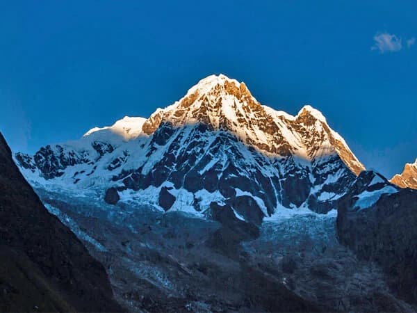 Annapurna sunrise over Base Camp, revealing the mighty peaks.